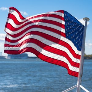 United States of America flag flying or waving in boat or cruise in the Hudson River.