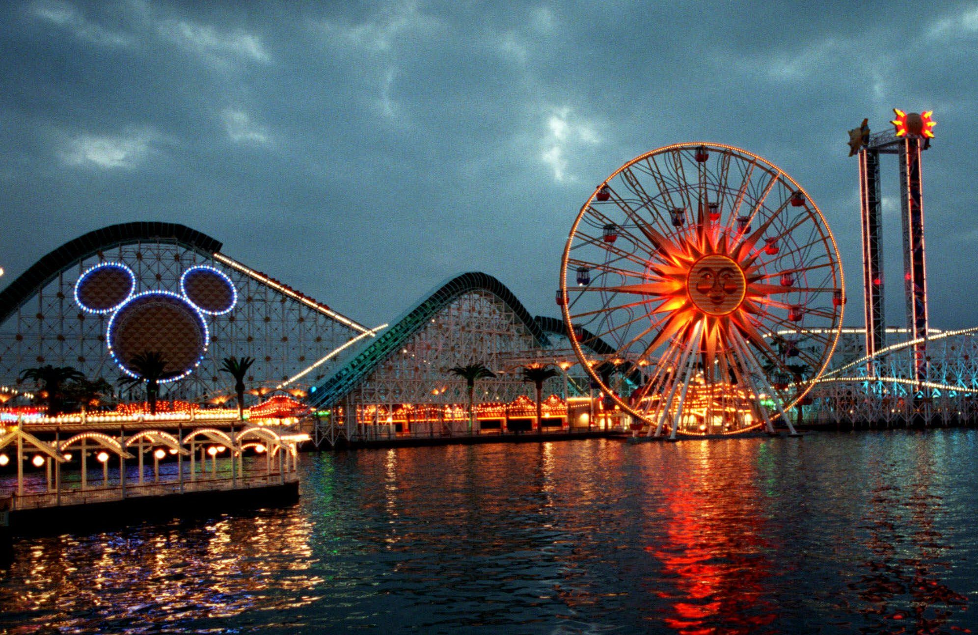 Mandatory Credit: Photo by Damian Dovorganes/AP/Shutterstock (6476118a) CALIFORNIA ADVENTURE Midway-type rides, one sporting the outline of Disney's famous character, Mickey Mouse, are seen, at California Adventure in Anaheim, Calif., the latest addition to the Walt Disney theme park family. The park, adjacent to Disneyland, opens Feb. 8 and will feature miniature versions of the best the state has to offer, from historic landmarks to its natural terrain, wrapped around rides, stores and restaurants TRAVEL NEW DISNEY PARK, ANAHEIM, USA