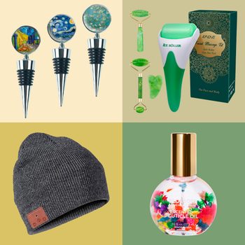 Three artistic bottle stoppers displayed, jade massage tools beside green box, grey knit beanie on mustard background, and floral-scented cuticle oil bottle.