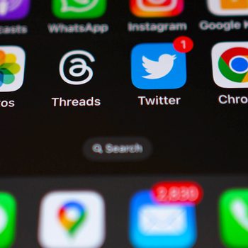 Smartphone screen displays app icons, including WhatsApp, Instagram, Twitter with a notification, and Chrome. Context shows a search bar and notification counts.