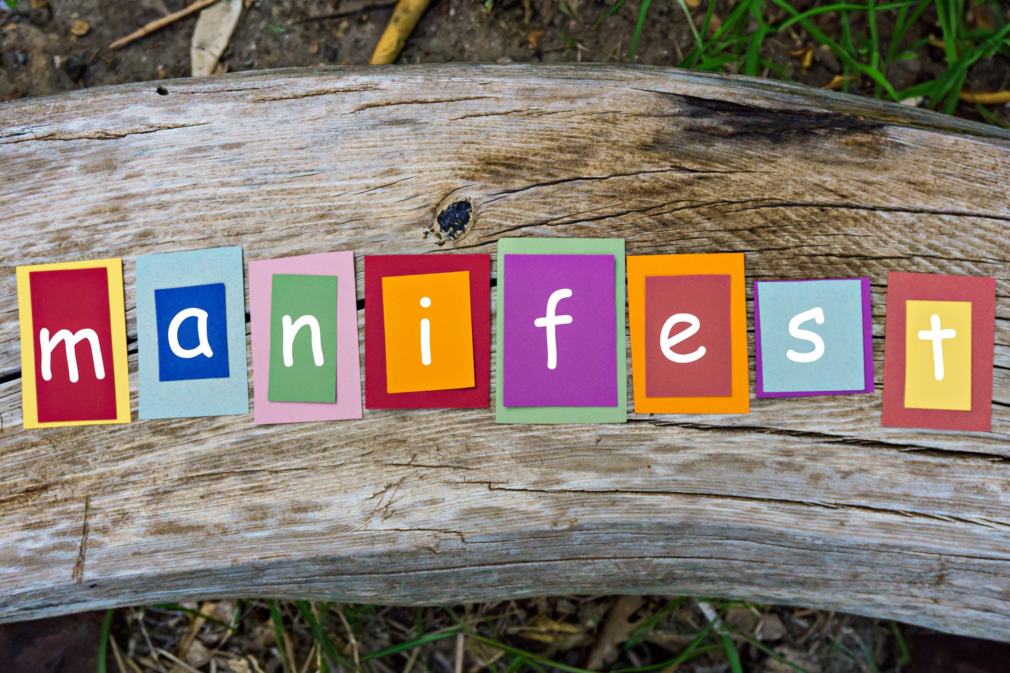 Manifest Word Written On Colorful Sticky Notes On Wooden Background
