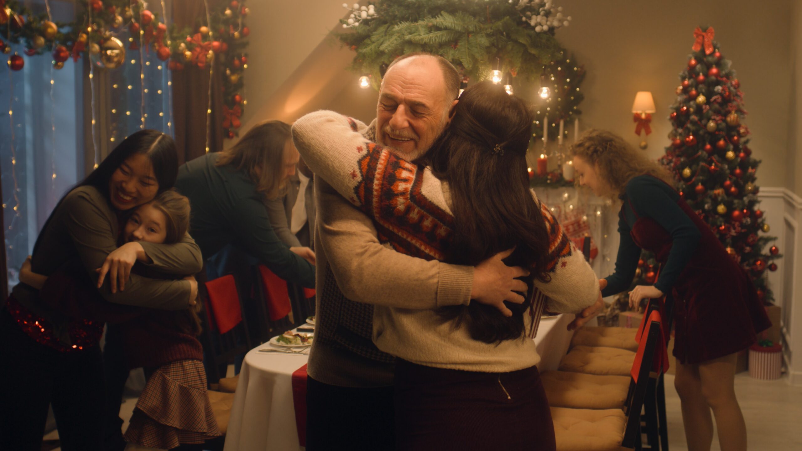Happy,diverse,family,meeting,each,other,at,cozy,home,for