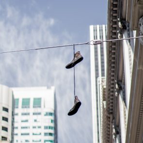 What Do Shoes On Power Lines Mean Gettyimages 1054492122