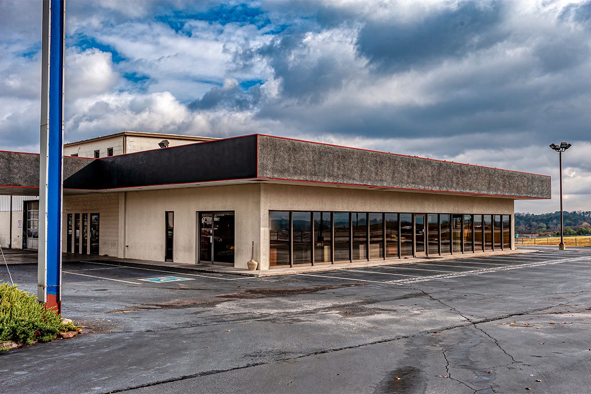 12 Eerie Abandoned Car Dealership Photos