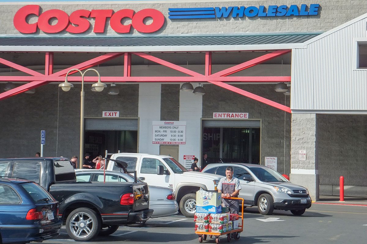 a male shopper pushes a shopping cart at COSTCO in California