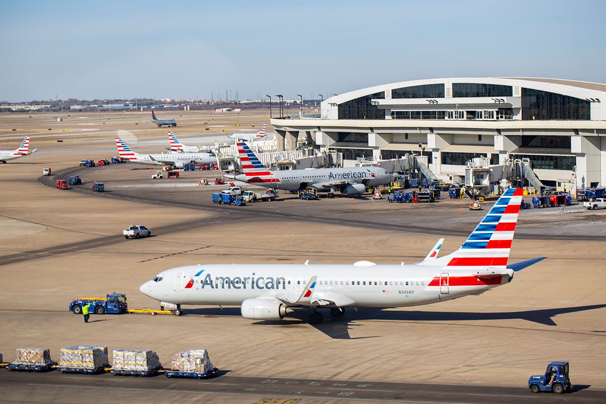 American Airlines Boeing being pushed back by tow truck at Dallas Fort Worth International Airport