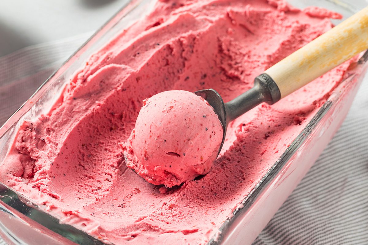 Homemade Berry Ice Cream in a glass bowl on a table
