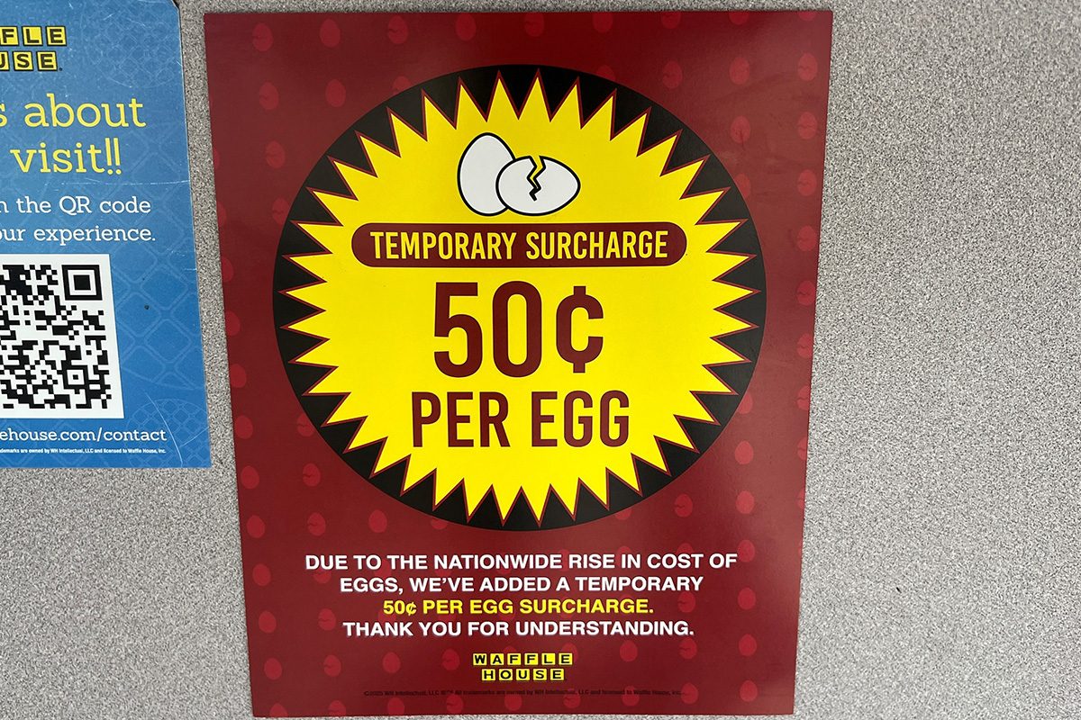 A notice in a Waffle House restaurant advises customers of a 50 cent price hike per egg due to the nationwide rise in cost of eggs
