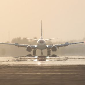 Aircraft ready for takeoff on a scorching day, plane lined up for departure in extreme heat